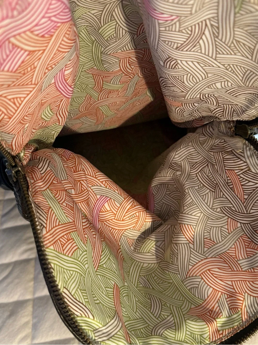 The Sak vertical flat leather